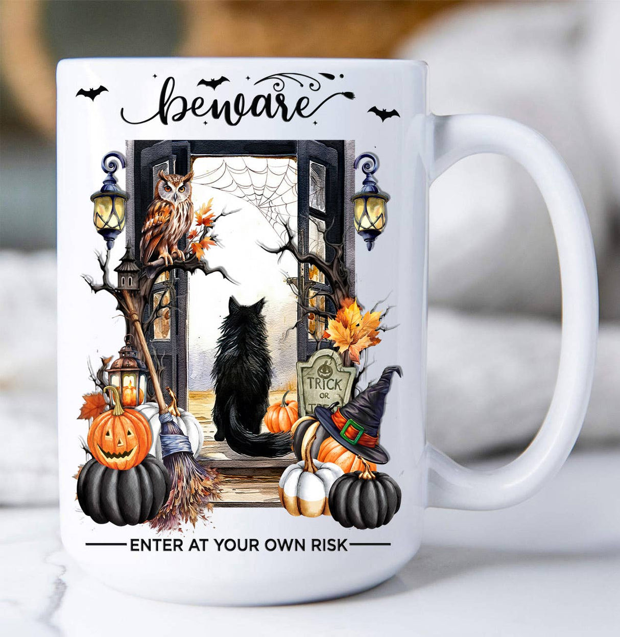 15oz ceramic Halloween mug with black cat, pumpkins, lanterns, owl, bats, and “Beware – Enter at Your Own Risk” text.
