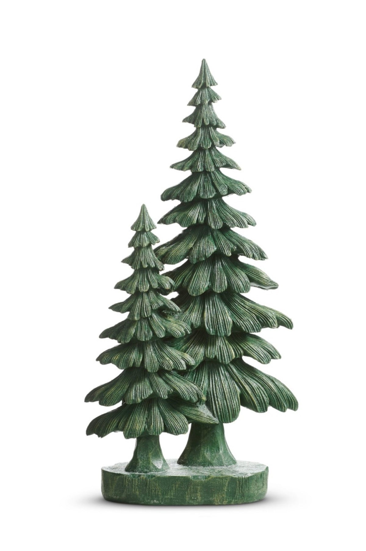 A decorative green spruce tree sculpture features two stylized evergreen trees with deeply carved branches and a rich evergreen finish. The dimensional layered boughs create striking texture and movement, while the coordinating base unites the two trees into a single woodland-inspired decorative accent. The tallest tree measures 19 inches high.
