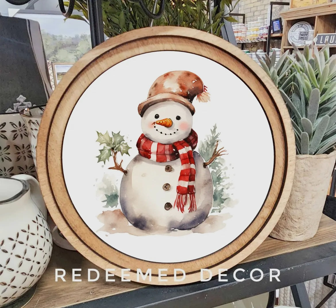 Frost & Fringe: A Snowman’s Cozy Winter Charm Round Framed Art