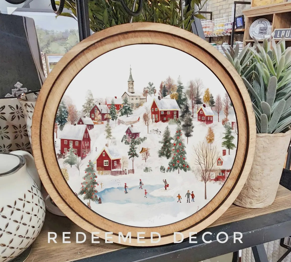 Silent Snowfall: A Cozy Village & Christmas Cheer Round Framed Art - H00605