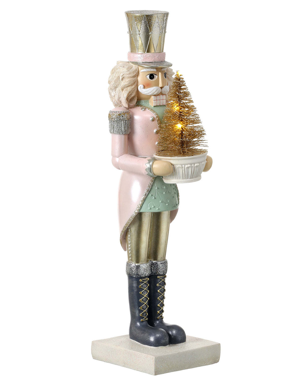A decorative nutcracker figurine painted in pearlized pastel colors, holding a lit champagne bottle brush tree, with details on its uniform and boots.