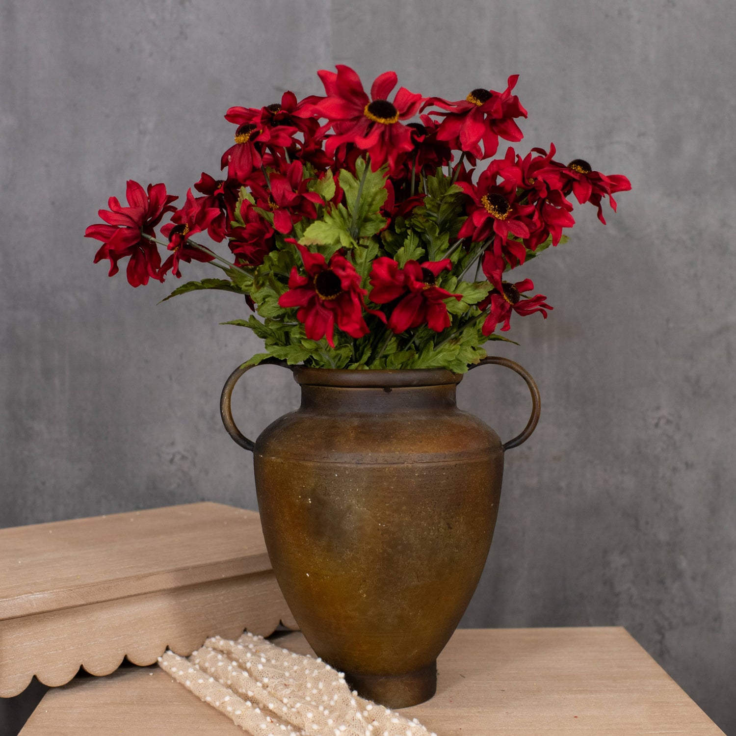 Red Black Eyed Susan faux floral stem arranged in a rustic metal vase