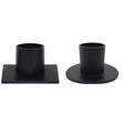 Two black metal taper candle holders on a white background