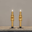 Gold nutcracker LED taper candles in 9.75" heights, featuring a sculpted design and realistic 3D flame.