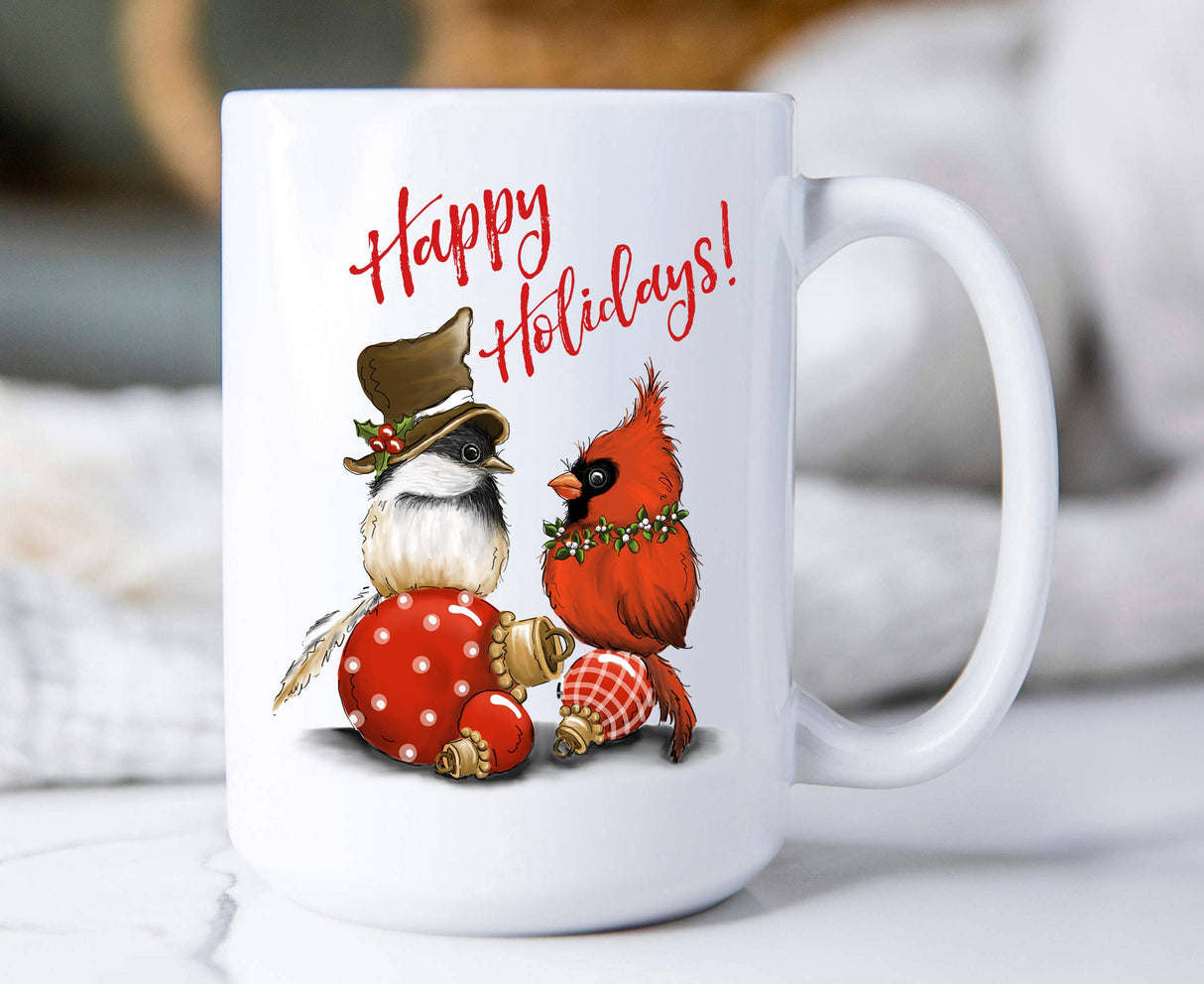 15oz ceramic Christmas mug with chickadee and cardinal perched on ornaments and “Happy Holidays” text.