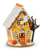 12-inch Halloween gingerbread house with orange walls, ghost in attic, pumpkins, witch hat door, black tree, and cookie base; light-up with timer