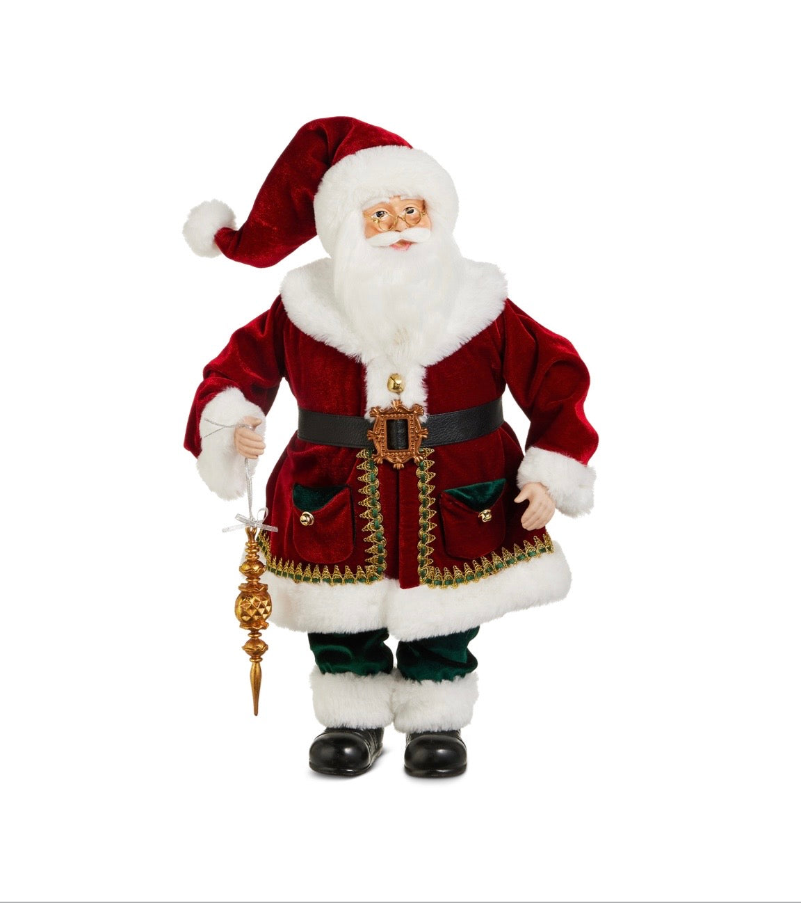 A standing Santa figure wears a rich burgundy velvet coat trimmed with luxurious white faux fur and accented with emerald green velvet details and gold embellishments. Santa carries a decorative gold finial ornament suspended from a silver ribbon while wearing gold spectacles and an ornate belt buckle. The elegant figure stands 20 inches tall and showcases heirloom-quality holiday styling.