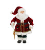 A standing Santa figure wears a rich burgundy velvet coat trimmed with luxurious white faux fur and accented with emerald green velvet details and gold embellishments. Santa carries a decorative gold finial ornament suspended from a silver ribbon while wearing gold spectacles and an ornate belt buckle. The elegant figure stands 20 inches tall and showcases heirloom-quality holiday styling.