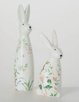 Set of two floral bunny figurines, one 9″ and one 12″ tall, with pastel flower accents—spring decor by Sullivans.