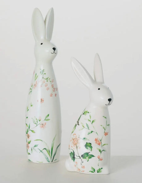Set of two floral bunny figurines, one 9″ and one 12″ tall, with pastel flower accents—spring decor by Sullivans.