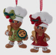 Two gingerbread chef-themed Christmas ornaments, one male and one female, on a white background.