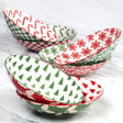 Winter Medley 9.25" porcelain dinner bowl with assorted red and green Christmas patterns, decorated inside and out, by Certified International