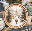 Round wooden framed artwork of a snowy scene with Santa Claus, 8-inch round canvas showing Santa walking through a snowy path toward a village chapel.