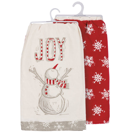 Joy Snowman Towel: Cream kitchen towel with a cheerful snowman and “JOY” lettering in red‑and‑white stripes.

Snowflake Towel: Red kitchen towel with an all‑over white snowflake pattern.