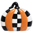 Small ceramic pumpkin with alternating orange and black‑and‑white check panels and a glossy black stem.